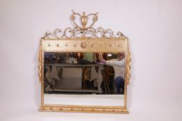 An Adam style giltwood and composition overmantel mirror with scroll and urn decoration, 42" x 44"