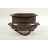 A Japanese bronze censer raised on tripod supports moulded in the form of bamboo, with cypress