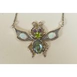 A 925 silver pendant necklace in the form of a winged insect, set with semi-precious stones, 1½"