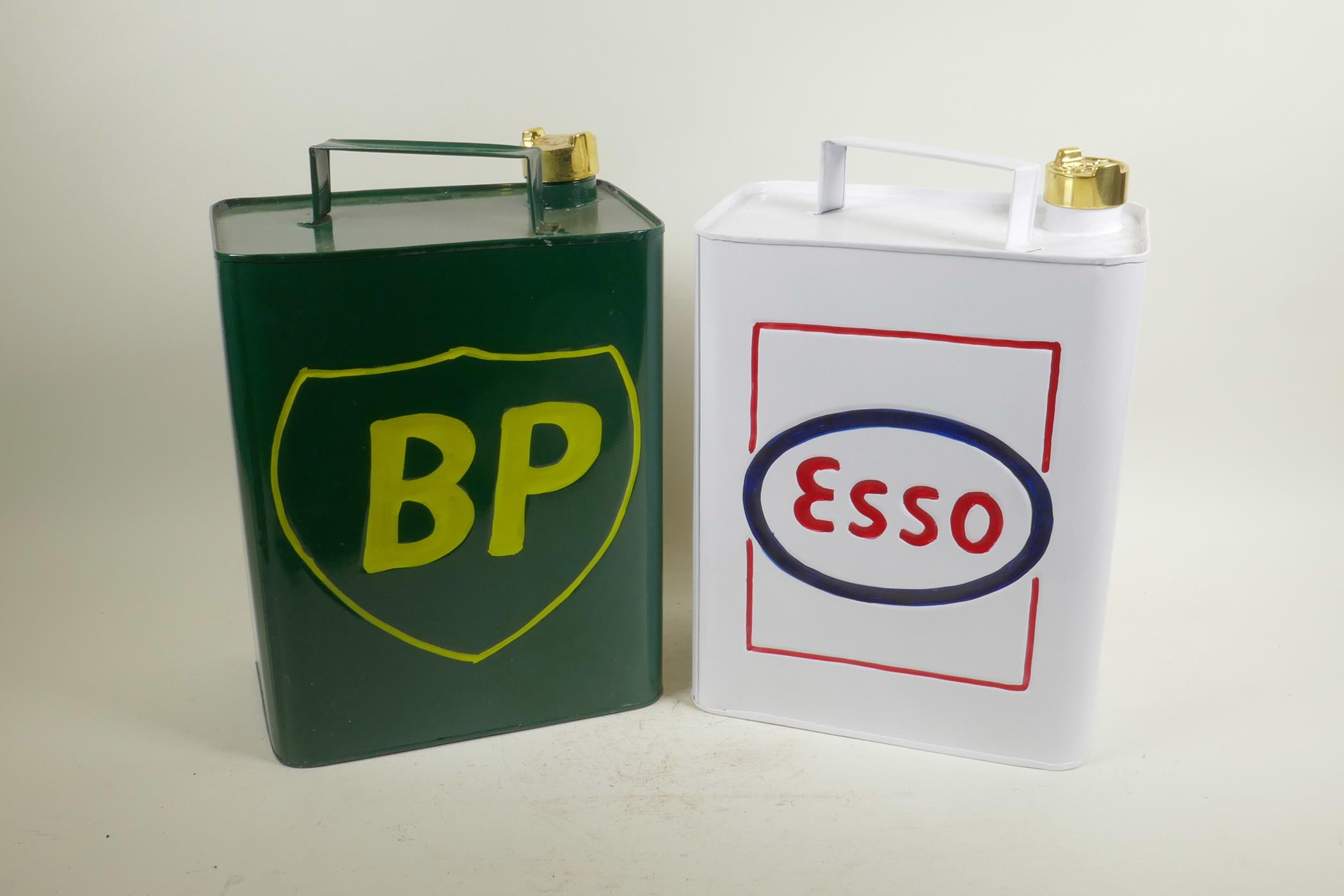 Two enamelled metal petrol cans, 12" high