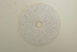 A Chinese white hardstone pi disc, with carved animal decoration, 8" diameter