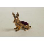 A 925 silver gilt novelty pincushion in the form of a rabbit, 1"