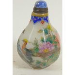 A Peking glass snuff bottle decorated with birds, flowers and insects, four character mark to