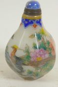 A Peking glass snuff bottle decorated with birds, flowers and insects, four character mark to