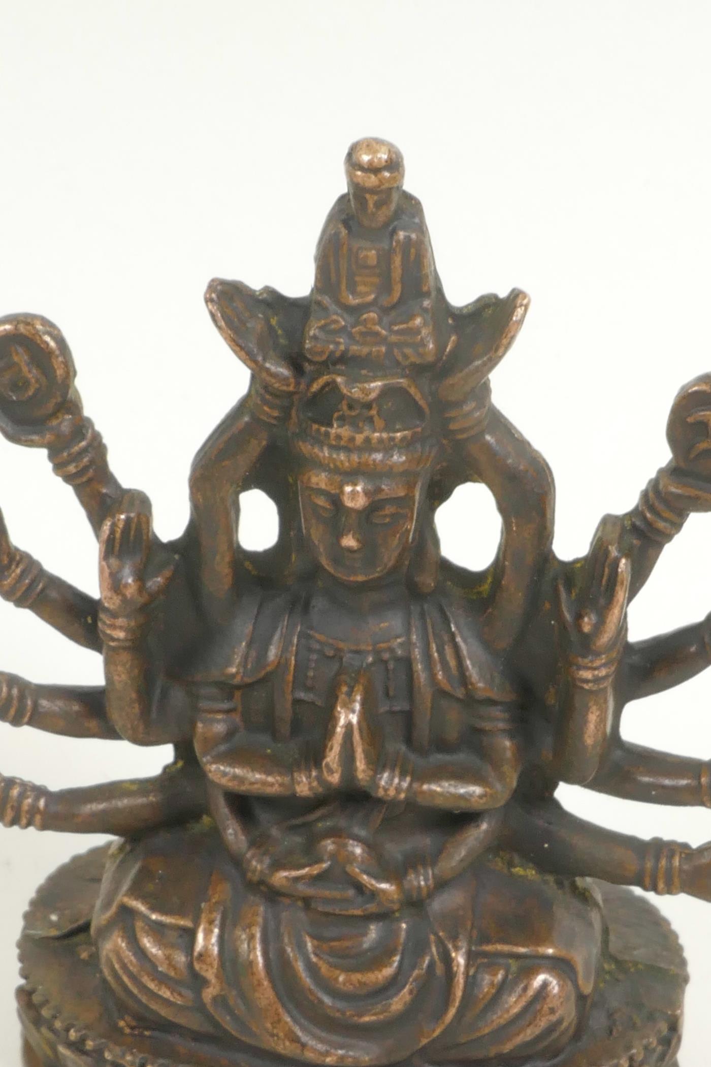 A bronze figure of a Hindu deity, seated in meditation on a lotus throne, 3" high - Image 2 of 3