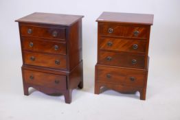 A matched pair of mahogany tallboy style bedside chests of four drawers, oak lined with hand cut