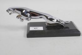 A chrome plated Jaguar car mascot mounted on a marble stand, 7½" long
