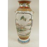 A Japanese Meiji style Satsuma pottery two handled vase decorated with figures in a landscape and