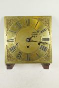 A C18th brass clock dial with Roman numerals, and a later English Garrard chiming striking clock