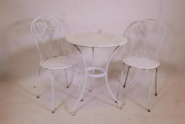 A painted metal bistro table and two chairs