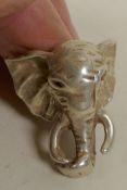A Chinese silver dress ring made in the form of an elephant head, size T