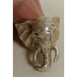 A Chinese silver dress ring made in the form of an elephant head, size T