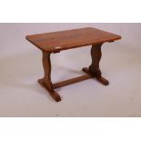 An ash refectory style coffee table on shaped end supports, 17½" x 27½" x 17¼"
