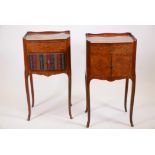 A pair of marquetry inlaid tulipwood side cabinets, with single drawer over two cupboards, raised on