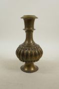 An Indian brass hookah base, the body of ribbed form, 8½" high