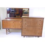 A mid century teak veneered chest of four drawers raised on tapering supports, 31" x 19" x 37", a