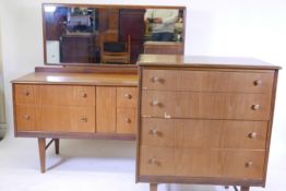 A mid century teak veneered chest of four drawers raised on tapering supports, 31" x 19" x 37", a