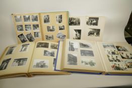 Four Japanese photograph albums containing photographs of socio-historical interest, largest 13" x