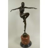 An Art Deco style bronze figure of a dancing girl, on a marble plinth, 22" high