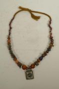 An Indian graduated hardstone, agate and coral bead necklace with a white metal and amethyst set