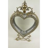 A heart shaped candle lantern in a pierced, plated metal case, 20½" high