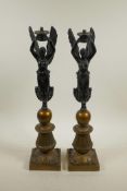 A pair of bronzed spelter lamps in the form of winged female figures, 18½" high