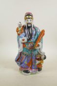 A Chinese polychrome porcelain figure of an emperor, 14" high