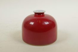 A Chinese red glazed porcelain ink pot, six character mark to base, 4" diameter