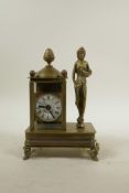 A brass cased mantel clock mounted on a music box playing Beethoven's Fur Elise, 7½" high