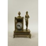 A brass cased mantel clock mounted on a music box playing Beethoven's Fur Elise, 7½" high