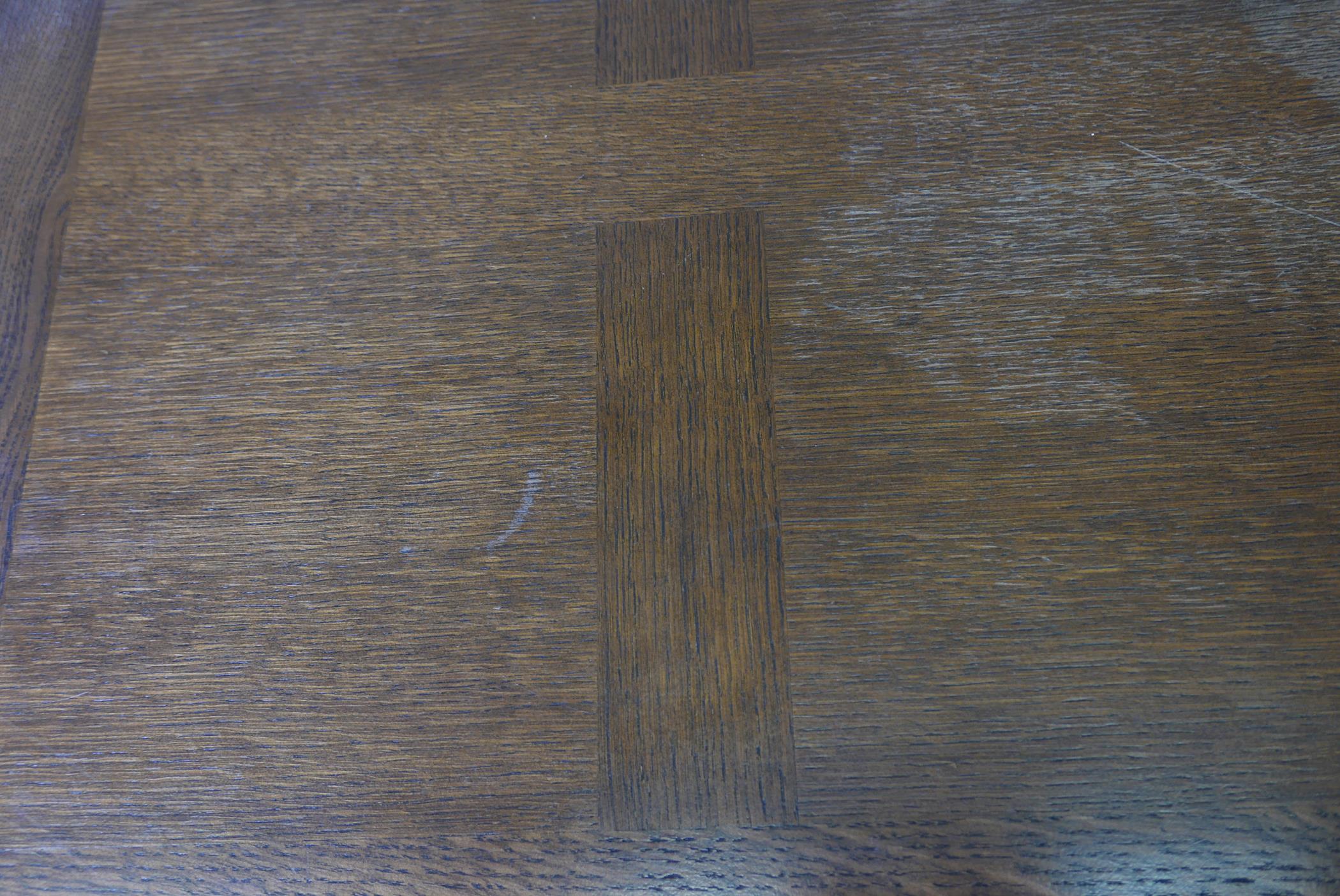 A French oak drawleaf dining table, with parquetry veneered top and pull out leaves, raised on - Image 3 of 4