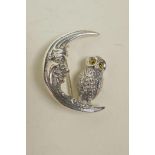 A sterling silver brooch in the form of an owl on a crescent moon, 1"