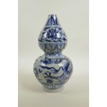 A Chinese Ming style blue and white porcelain vase with dragon and lotus flower decoration, 10" high