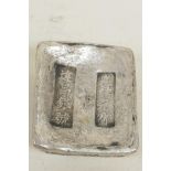 A Chinese white metal ingot decorated with calligraphy, 1½" x 2"