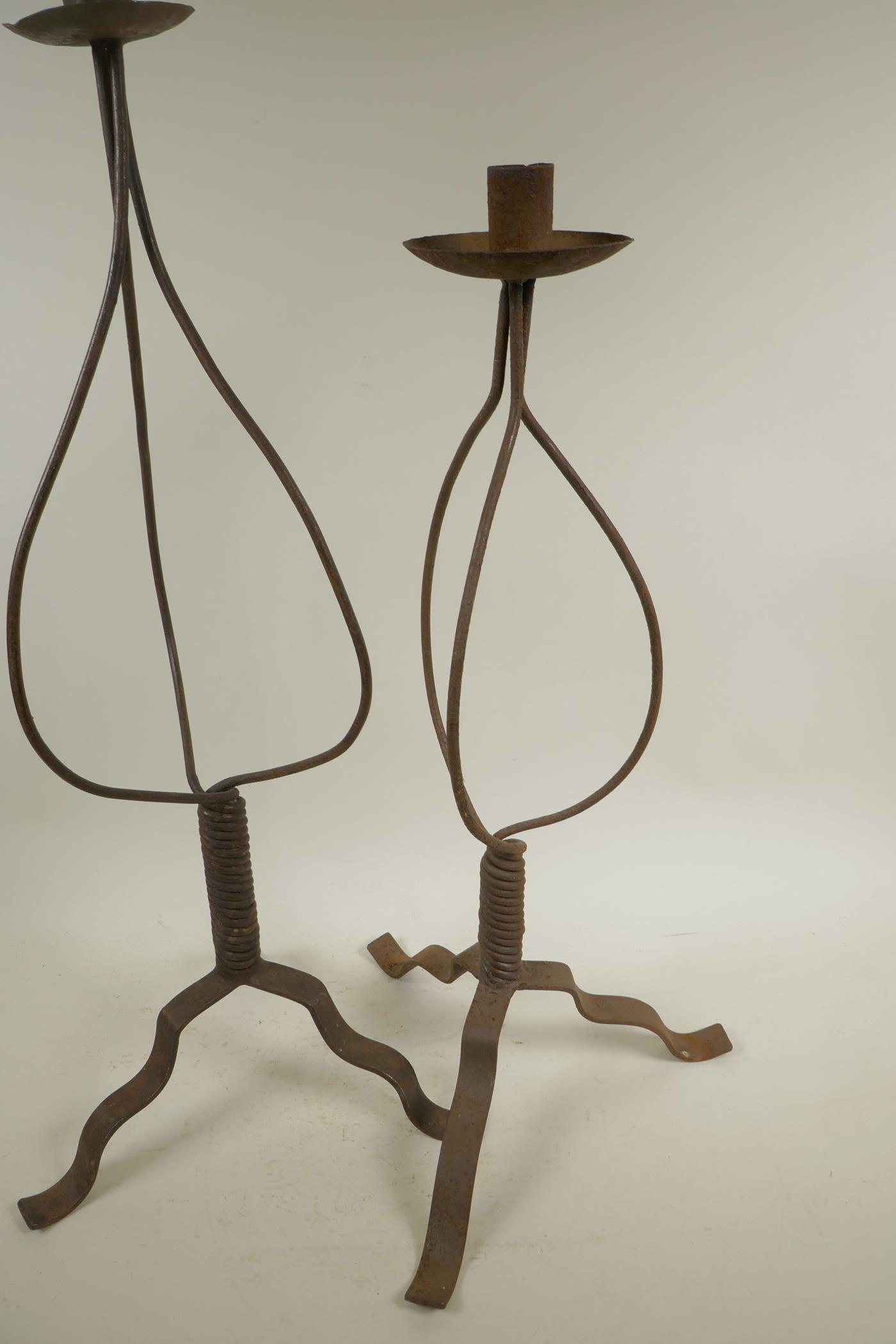 A wrought iron candlestick on tripod base, 24½" high, and another similar - Image 3 of 3