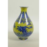 A Chinese yellow glazed porcelain pear shaped vase with blue and white landscape decoration, seal
