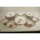 A Bridgewater Pottery rose pattern part service comprising 11" bowl (small chip), ten 10" plates,