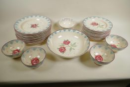 A Bridgewater Pottery rose pattern part service comprising 11" bowl (small chip), ten 10" plates,