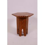 A Moorish style inlaid solid yew wood occasional table, with fold up base and hexagonal top, 14" x