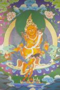 A Sino-Tibetan printed thangka depicting a deity with a rat and peach, 26" x 36"