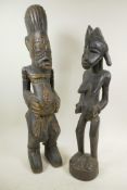 Two African carved wood ritual figures, largest 22" high
