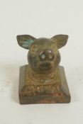 A Chinese brass seal, the handle formed as a pig's head, 1" square