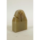 A Chinese carved soapstone scroll weight, 2½" x 3½"