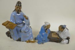 A Chinese, Shiwan style, mud men figure of two men playing Go, 9" long, together with a figure of