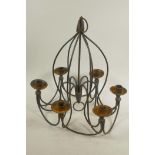 A wrought iron six branch candelabra, 14" drop, 14" diameter