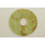 A Chinese polished hardstone pi disc, 3" diameter