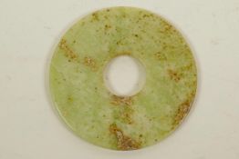 A Chinese polished hardstone pi disc, 3" diameter