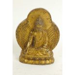 A gilt bronze figure of Buddha, 2½" high