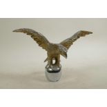 A plated metal car mascot in the form of an eagle, 9" wide