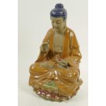 A Chinese, Shiwan style, pottery figure of Buddha seated in meditation on a lotus throne, 12"